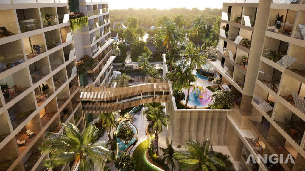 - une vue sur un bâtiment doté d'une piscine et de palmiers dans l'établissement CĂN HỘ 5 SAO THE SÓNG VŨNG TÀU Mr VƯƠNG, à Vung Tau