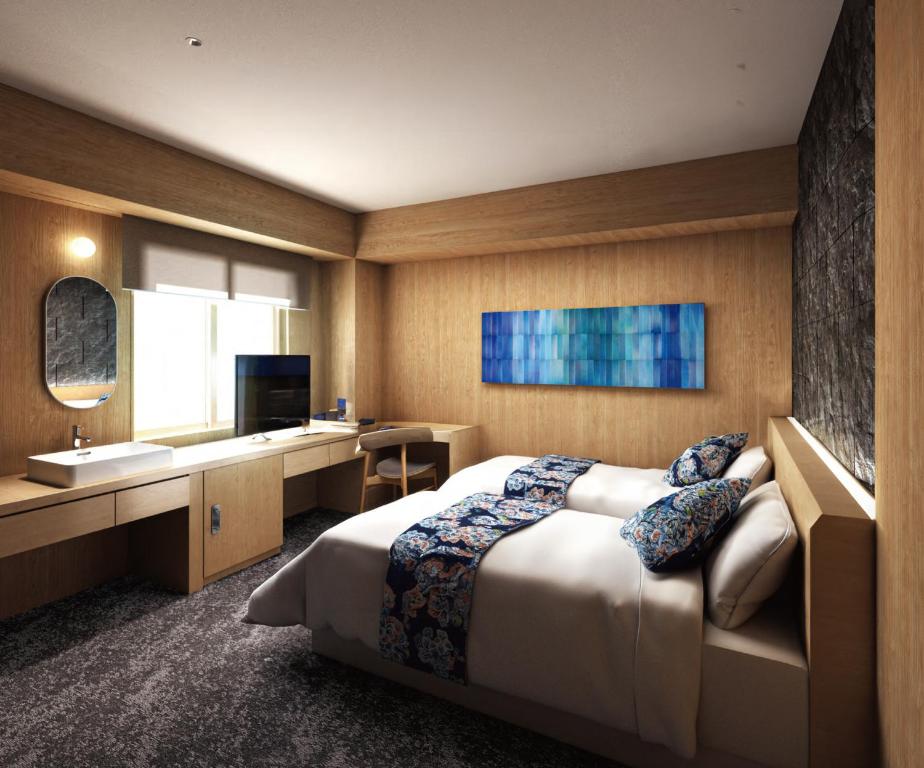 Postel nebo postele na pokoji v ubytování Hotel Naha City -Kokusai Street-