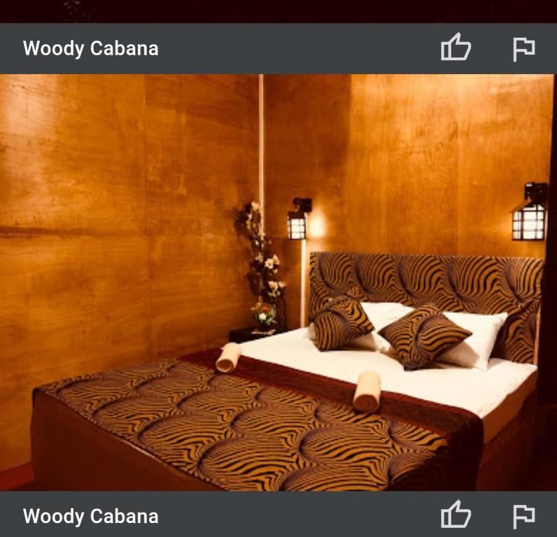 Postel nebo postele na pokoji v ubytování Woody Cabana