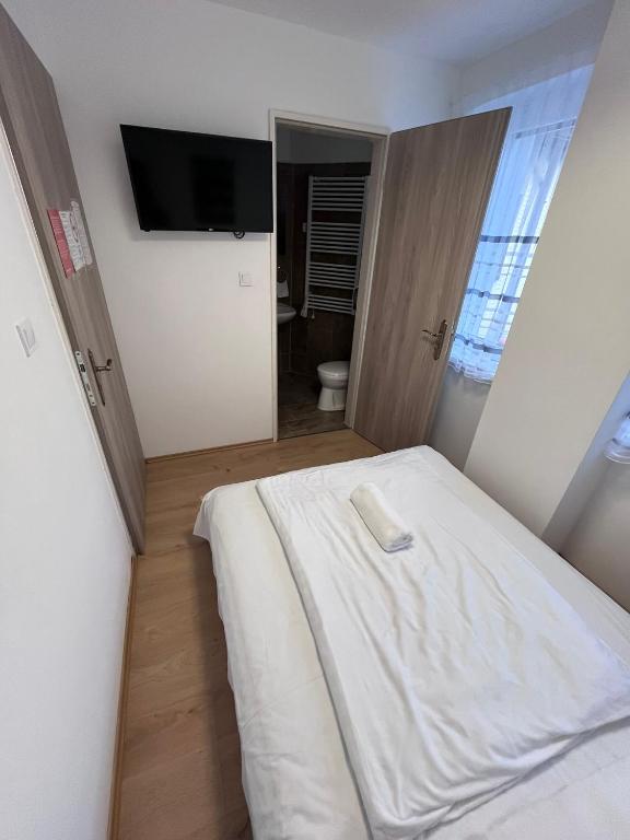 Postel nebo postele na pokoji v ubytování Május 1 Vendégház - Torony