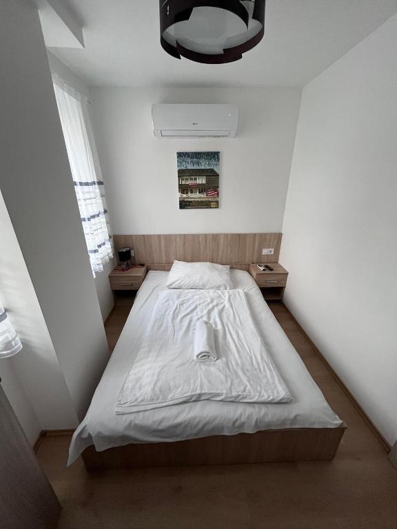 Postel nebo postele na pokoji v ubytování Május 1 Vendégház - Torony