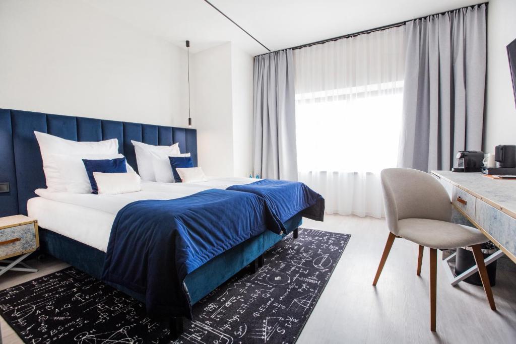 Postel nebo postele na pokoji v ubytování Hotel M23