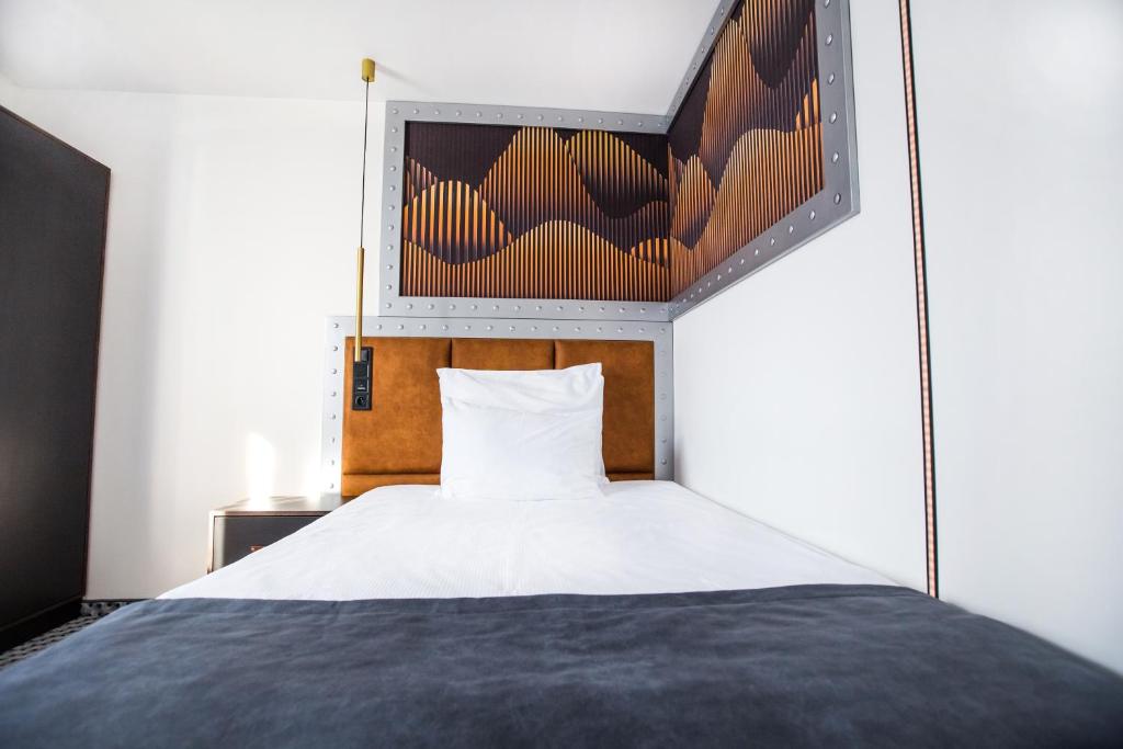 Postel nebo postele na pokoji v ubytování Hotel M23