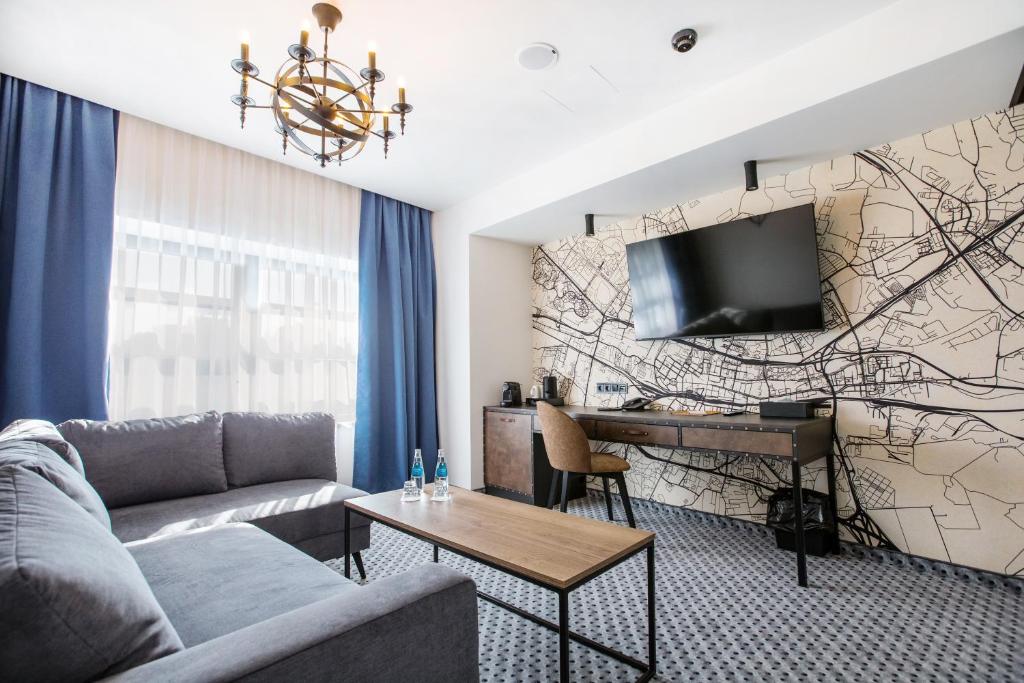 TV a/nebo společenská místnost v ubytování Hotel M23