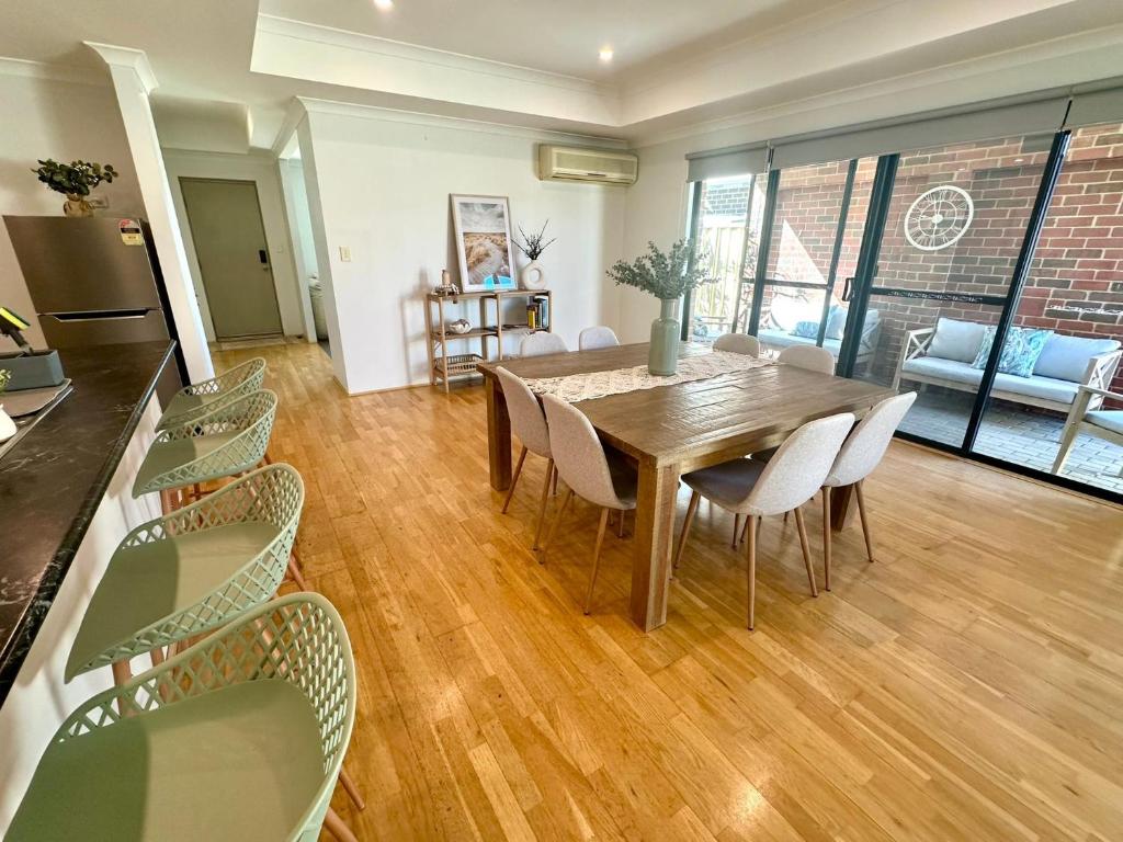 a kitchen and dining room with a table and chairs at Eucalyptus Escape - Dunsborough in Dunsborough