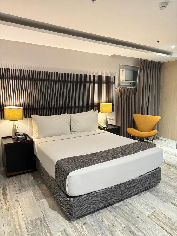 Postel nebo postele na pokoji v ubytování 1A Express Hotel
