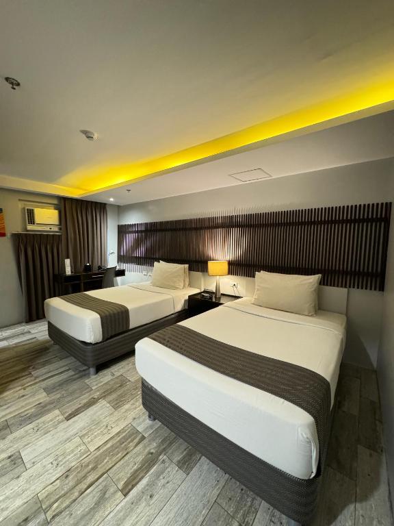 Postel nebo postele na pokoji v ubytování 1A Express Hotel