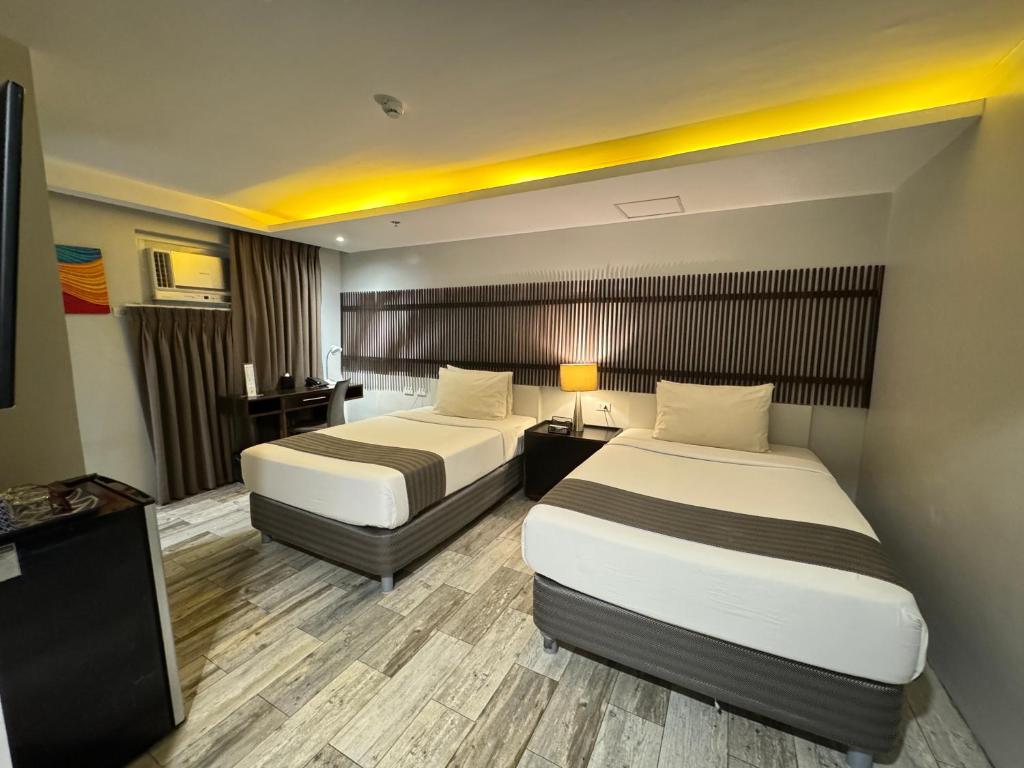 Postel nebo postele na pokoji v ubytování 1A Express Hotel