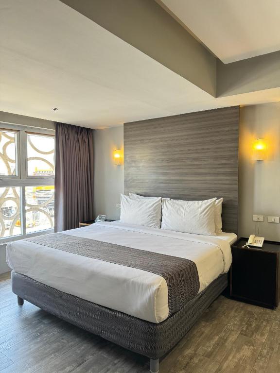 Postel nebo postele na pokoji v ubytování 1A Express Hotel