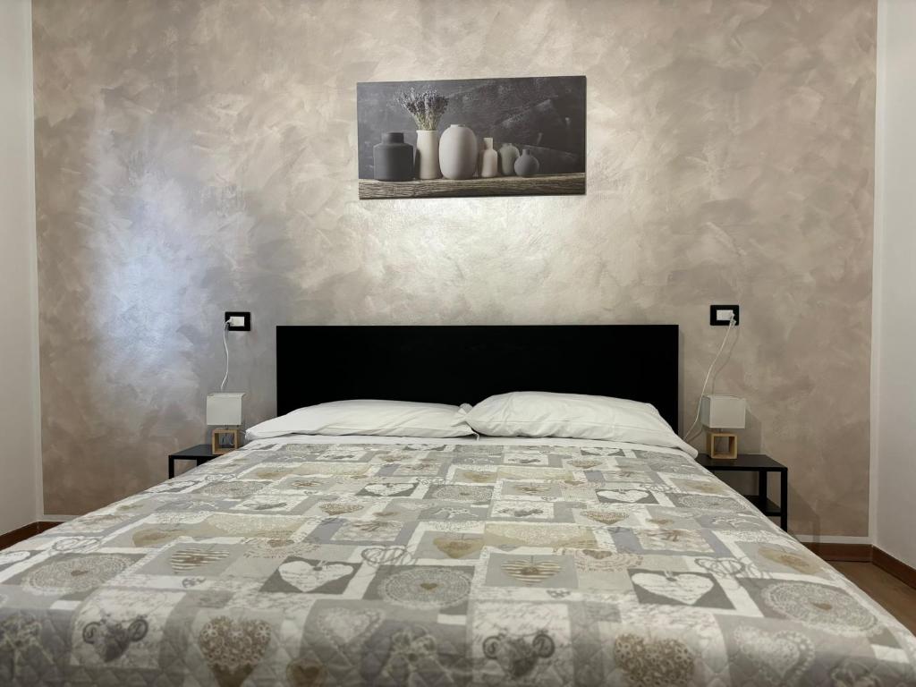 Postel nebo postele na pokoji v ubytování Agriturismo B&B La Cerasa
