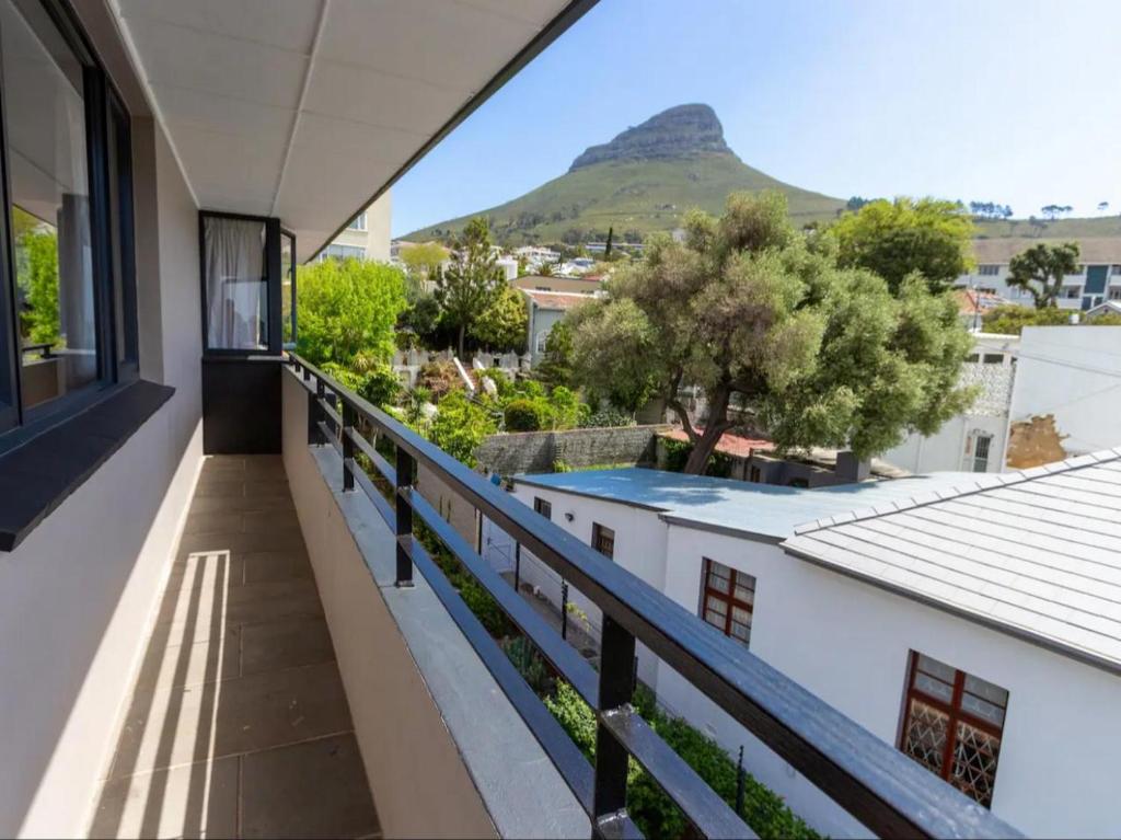 a balcony with a view of a mountain at Parioli Court in Cape Town