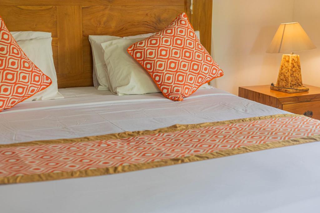 Postel nebo postele na pokoji v ubytování Gopala Villa Ubud