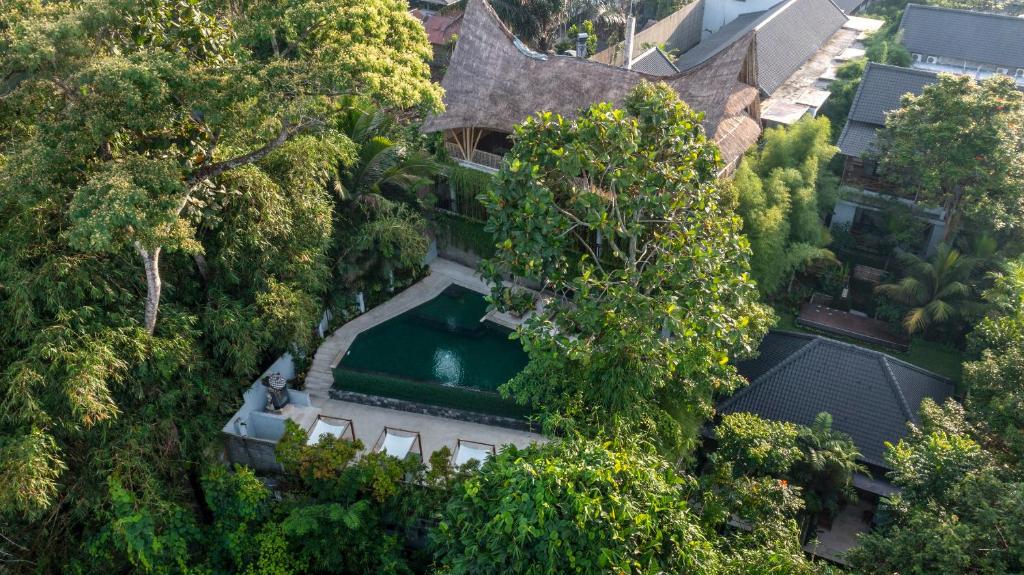an overhead view of a house with a swimming pool at Dinara Ubud in Ubud