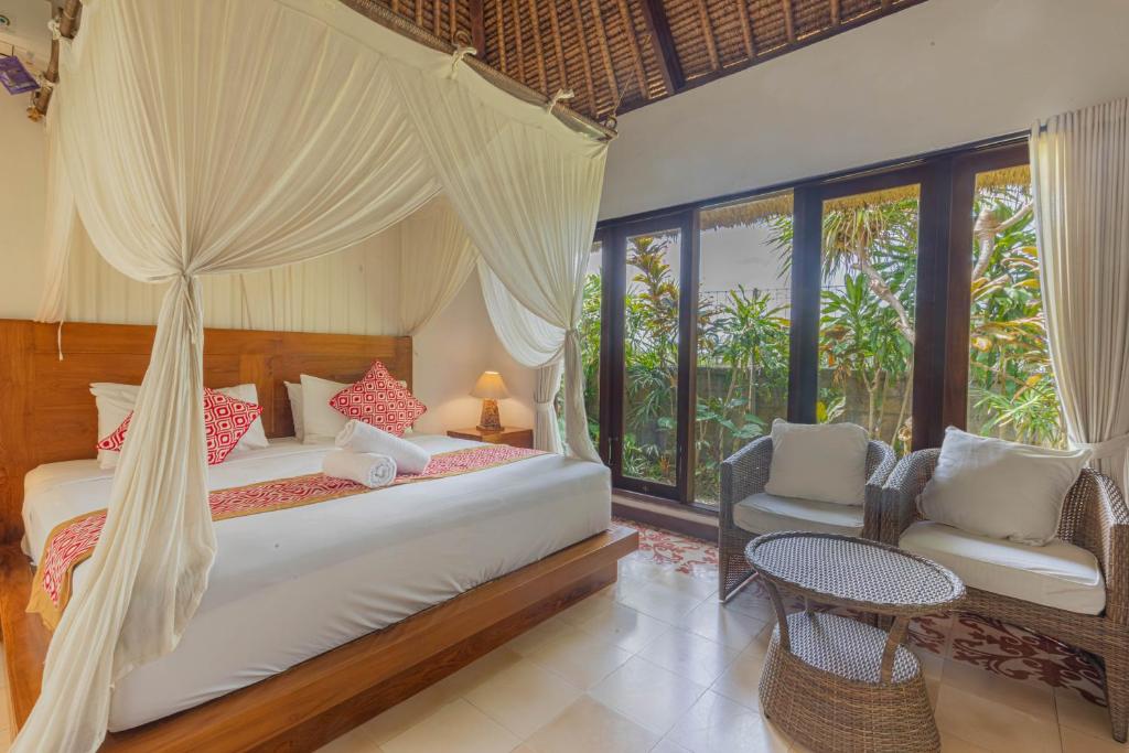 Postel nebo postele na pokoji v ubytování Gopala Villa Ubud