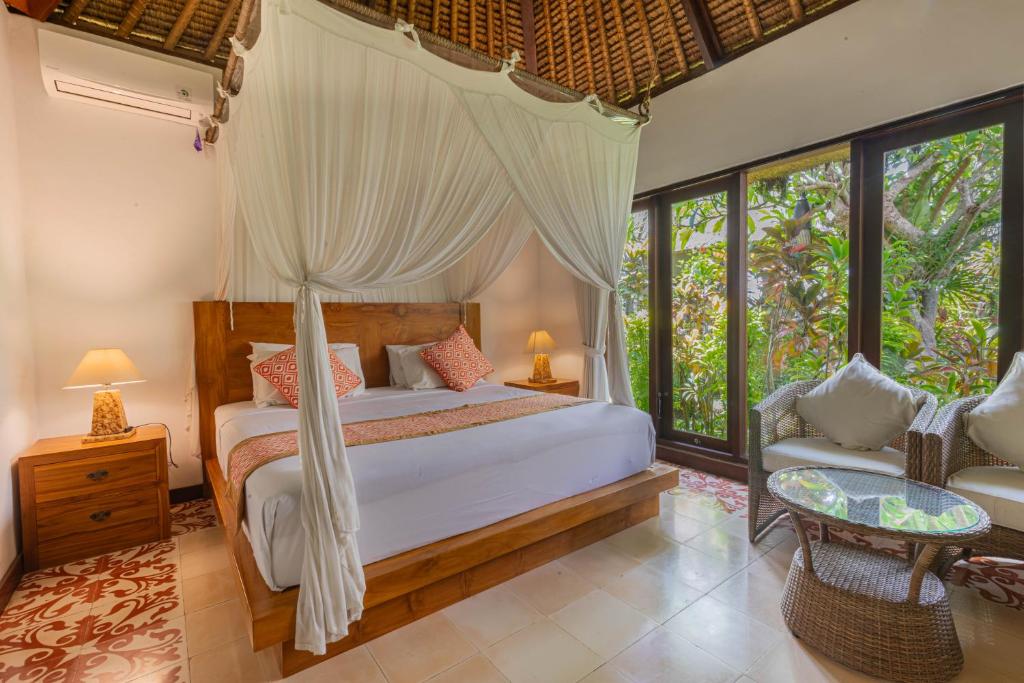 Postel nebo postele na pokoji v ubytování Gopala Villa Ubud