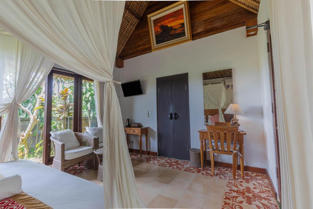 Postel nebo postele na pokoji v ubytování Gopala Villa Ubud