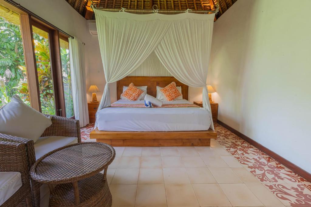 Postel nebo postele na pokoji v ubytování Gopala Villa Ubud
