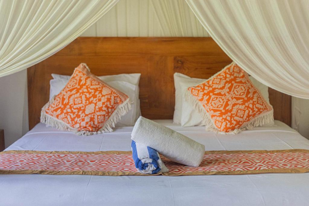 Postel nebo postele na pokoji v ubytování Gopala Villa Ubud