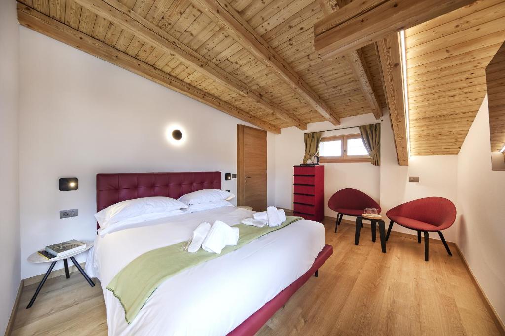Postel nebo postele na pokoji v ubytování Locanda Boton D'Oro