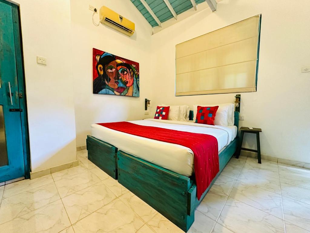 a bedroom with a large bed in a room at Moi Galle Fort by DBI in Galle