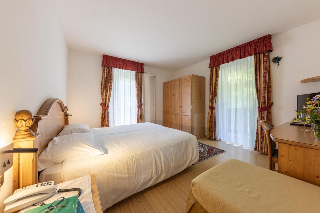 Postel nebo postele na pokoji v ubytování Hotel Plank