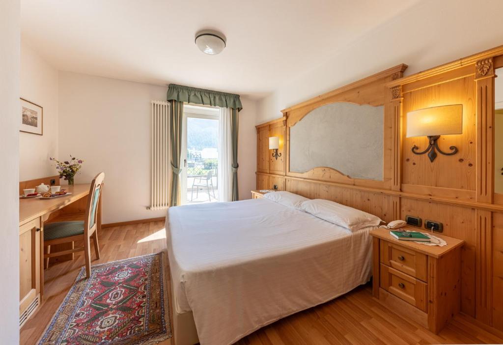 Postel nebo postele na pokoji v ubytování Hotel Plank