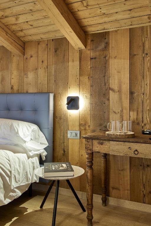 Postel nebo postele na pokoji v ubytování Locanda Boton D'Oro