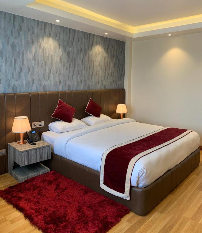 Postel nebo postele na pokoji v ubytování Hotel Flower