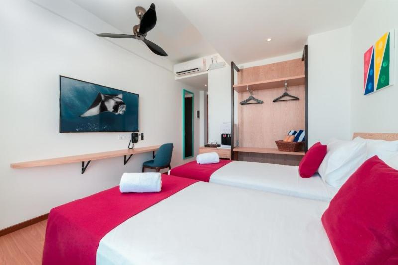 Postel nebo postele na pokoji v ubytování Ranthari Hotel and Spa Ukulhas Maldives