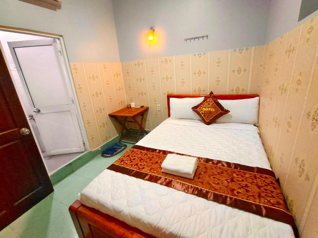 En eller flere senge i et værelse på Như Quỳnh Hotel HCM