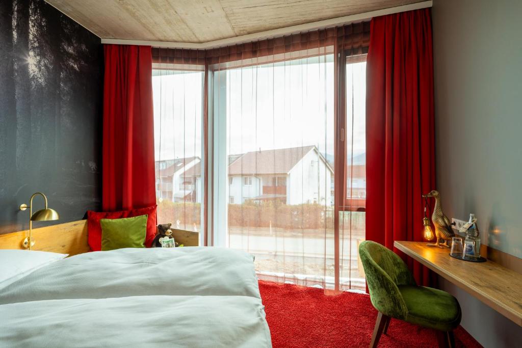Postel nebo postele na pokoji v ubytování mightyTwice Hotel Achern