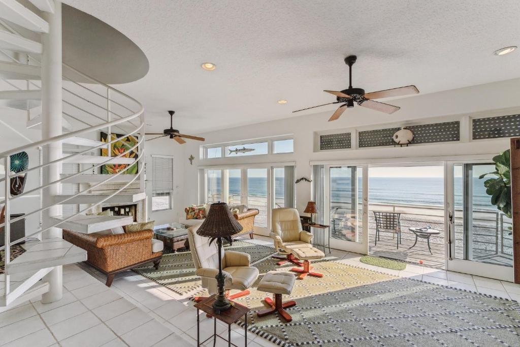 a living room with a view of the ocean at Breathtaking Beach Front House home in St. Augustine