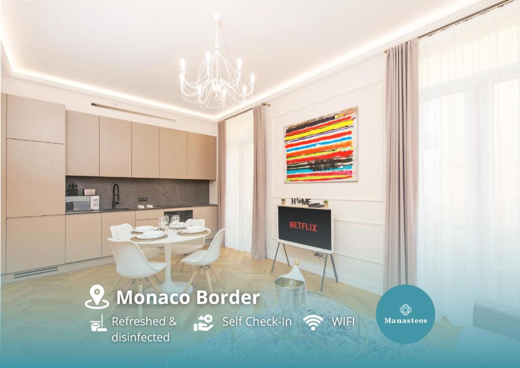Hotel 5mn Monaco - Luxueux appartement - BT, a kitchen with a table and chairs in a room at 5mn Monaco - Luxueux appartement - BT in Beausoleil