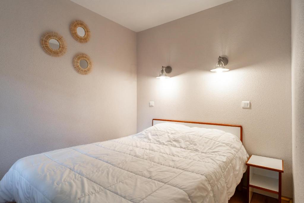 Postel nebo postele na pokoji v ubytování L’Estuaire - Appt avec piscine partagée
