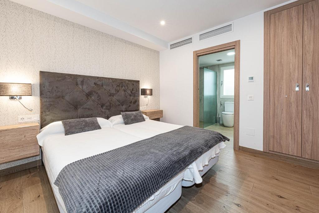 Posteľ alebo postele v izbe v ubytovaní Hostal Boutique Aurora