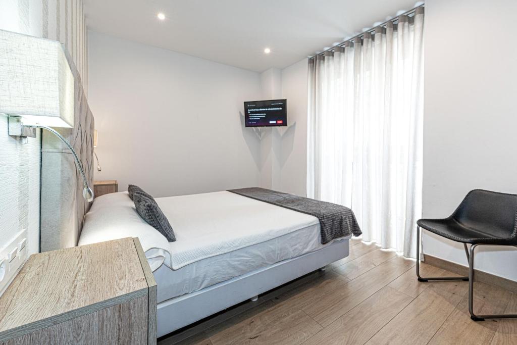 Posteľ alebo postele v izbe v ubytovaní Hostal Boutique Aurora