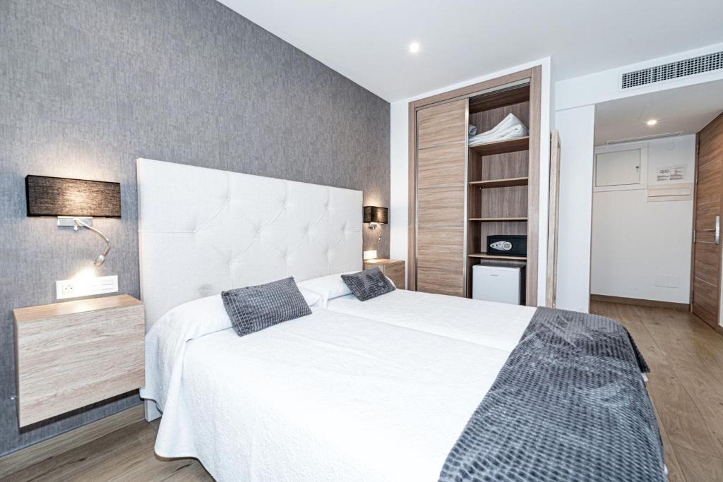 Posteľ alebo postele v izbe v ubytovaní Hostal Boutique Aurora