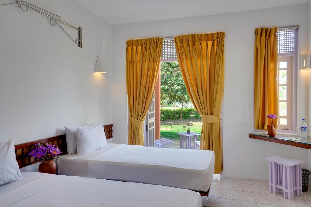 Postel nebo postele na pokoji v ubytování AIDA Hotel - Bentota