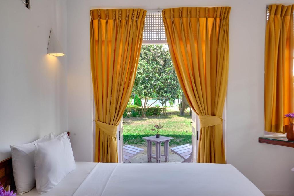 Postel nebo postele na pokoji v ubytování AIDA Hotel - Bentota
