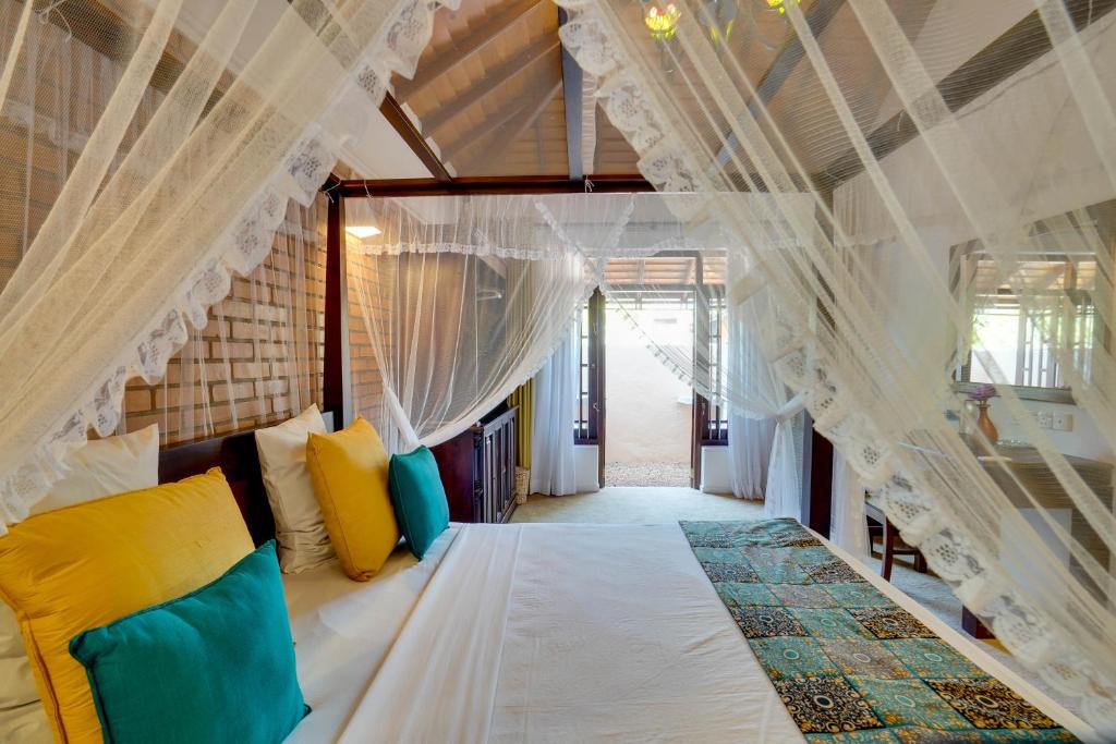 Postel nebo postele na pokoji v ubytování AIDA Hotel - Bentota