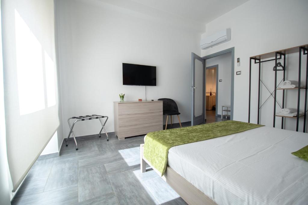 Łóżko lub łóżka w pokoju w obiekcie Casa Vacanze Family House posizione centralissima