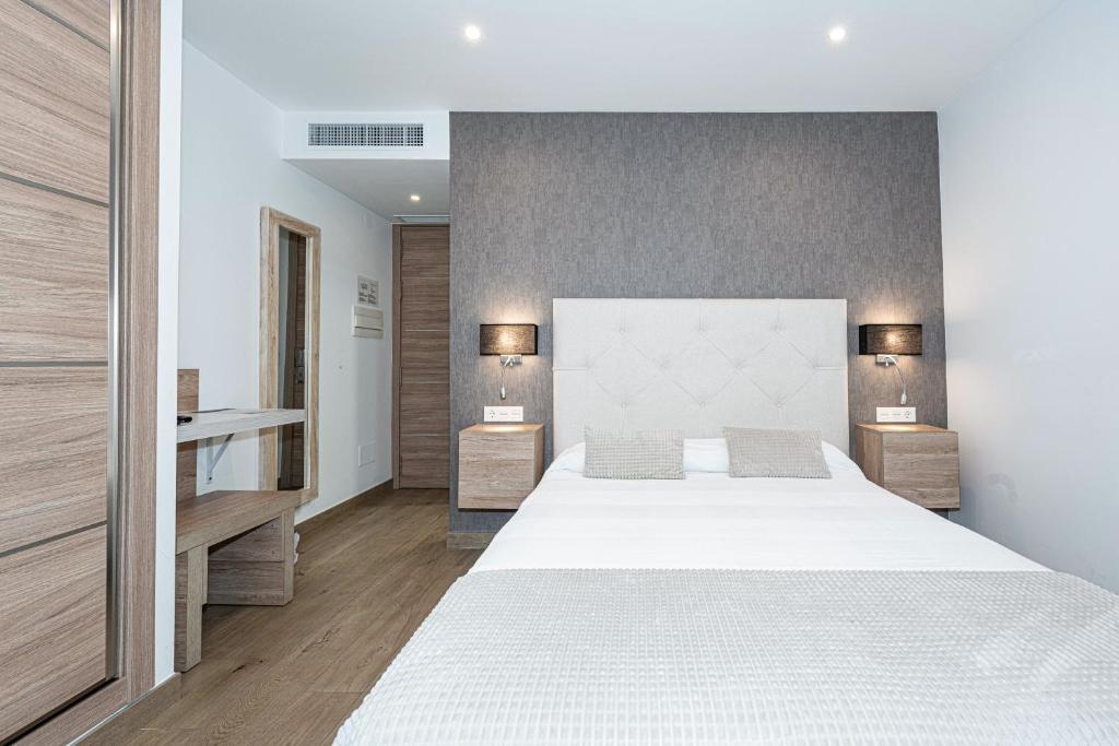 Posteľ alebo postele v izbe v ubytovaní Hostal Boutique Aurora