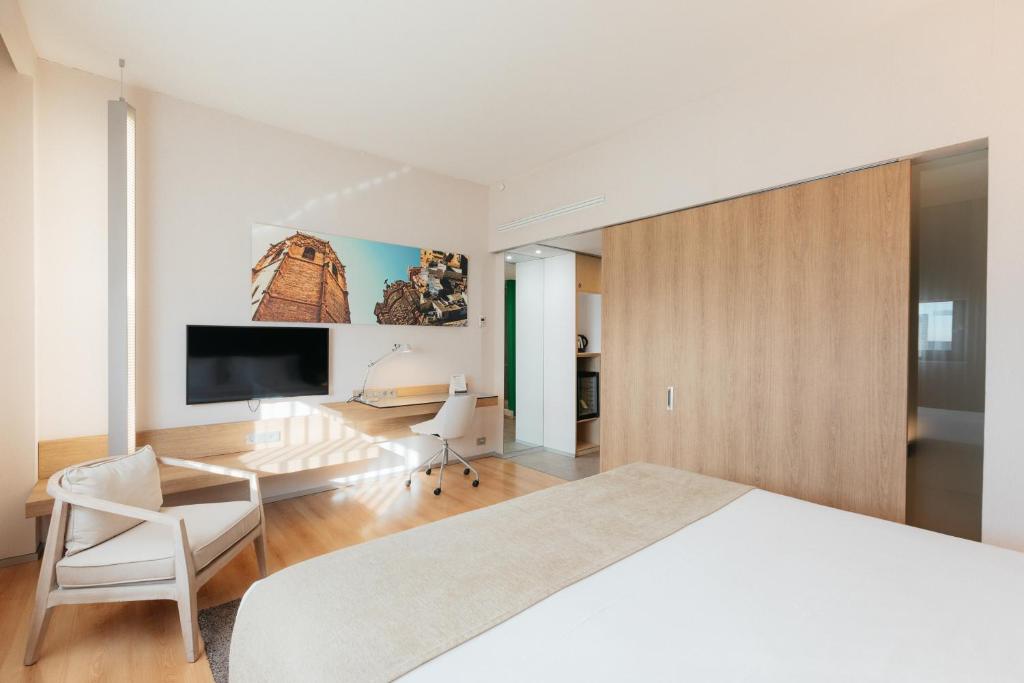 TV a/nebo společenská místnost v ubytování Barceló Valencia