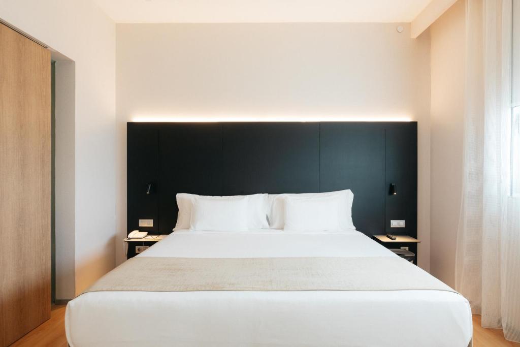 Postel nebo postele na pokoji v ubytování Barceló Valencia