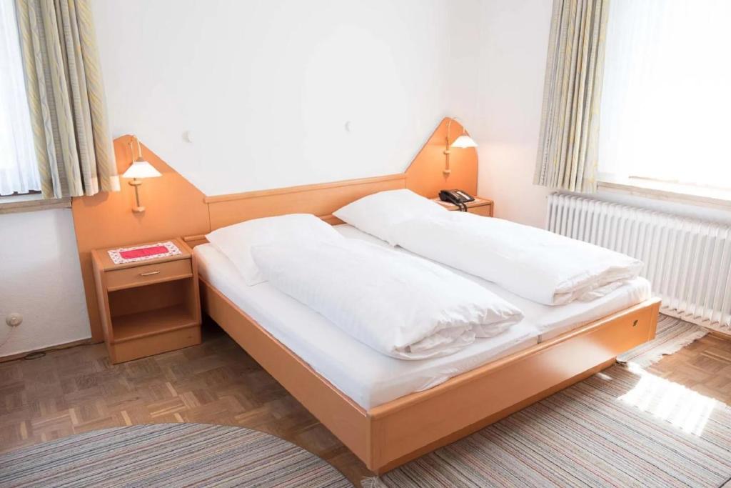 Postel nebo postele na pokoji v ubytování Pension Isernhagen