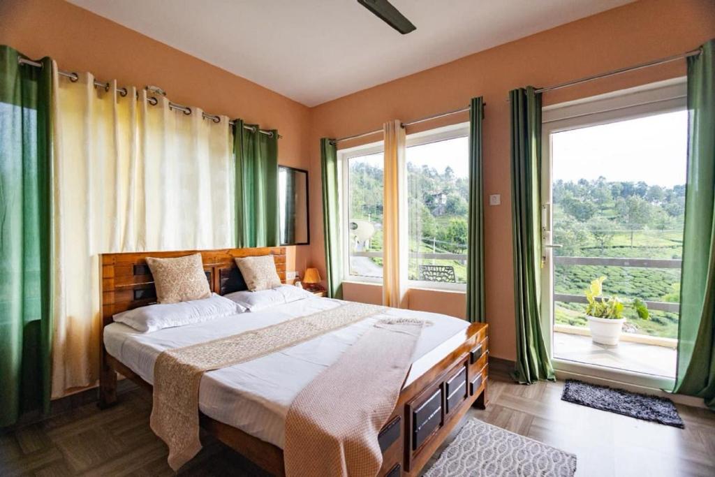a bedroom with a large bed and a large window at Moonlight Chillers By LexStays in Yedapalli