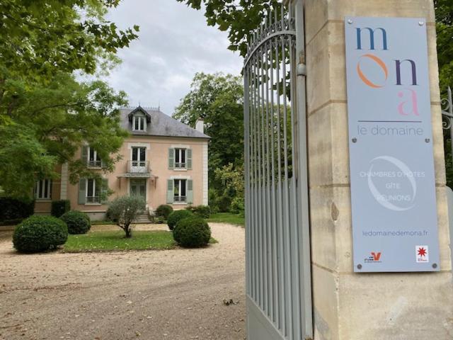 a gate to a house with a sign on it at LE DOMAINE DE MONA - Gîte de caractère in Cergy