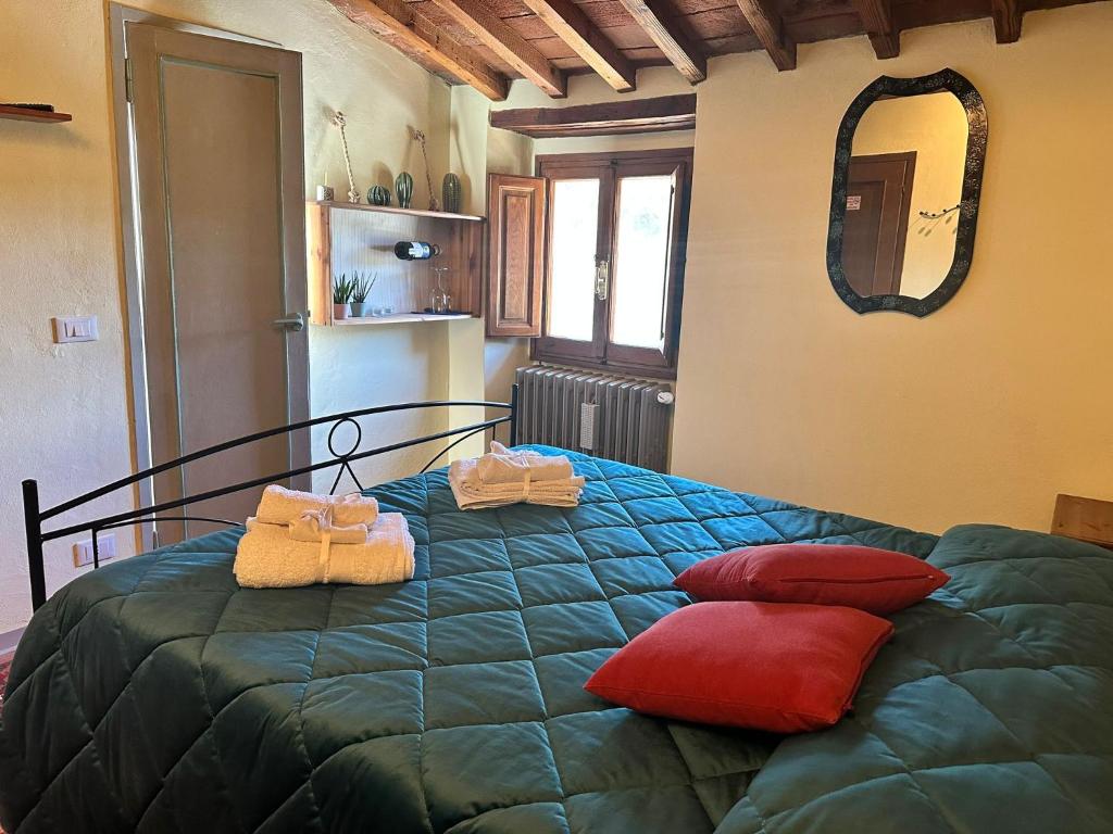 Postel nebo postele na pokoji v ubytování Agriturismo Tassinaia