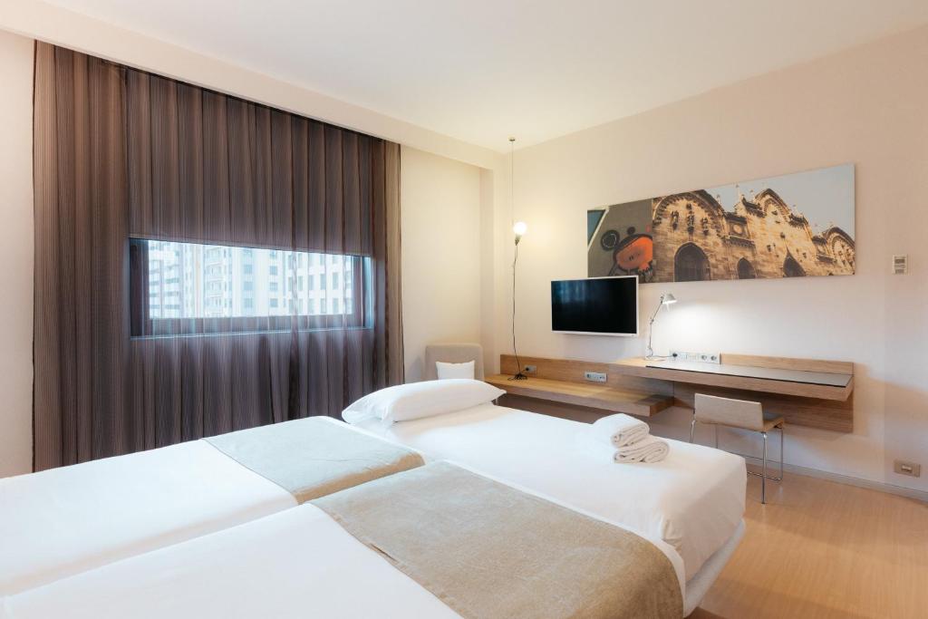 Postel nebo postele na pokoji v ubytování Barceló Valencia