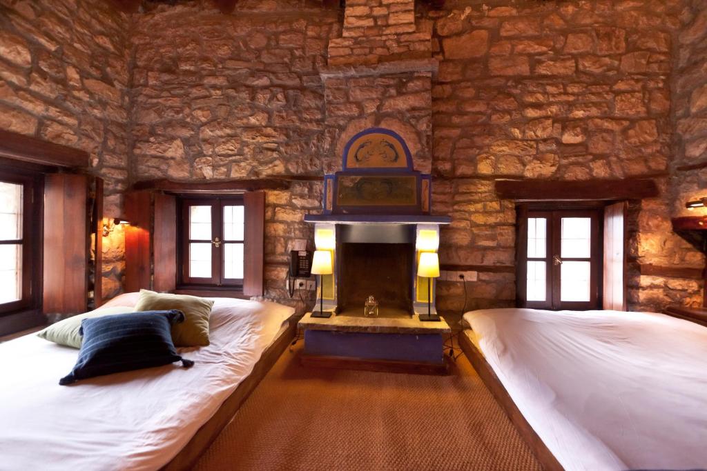A bed or beds in a room at Arhontiko Aristis